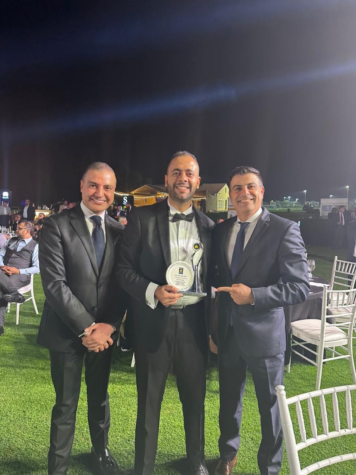 Rami Kamar receiving IT Champion award with colleagues